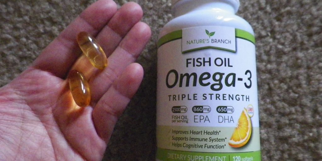 happy dog eating fish oil supplement